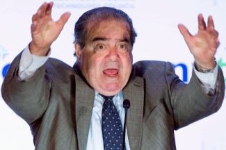 Supreme Court Justice Antonin Scalia makes gestures as he speaks at the Northern Virginia Technology Council's (NVTC) Titans breakfast gathering in McLean, Va., Wednesday, Sept. 25, 2013. Scalia was the featured speaker at the speaker series sponsored by the Council. The 77-year-old justice, currently the longest serving on the nine-member court, is scheduled to discuss the art of persuasion as well as major constitutional issues. (AP Photo/Manuel Balce Ceneta)