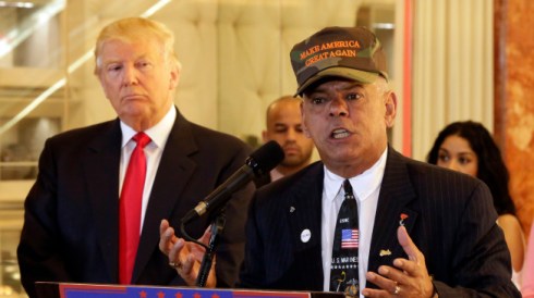 Republican presidential candidate Donald Trump listens at ;eft as Al Baldasaro, a New Hampshire state representative, speaks during a news conference in New York, Tuesday, May 31, 2016. (AP Photo/Richard Drew)